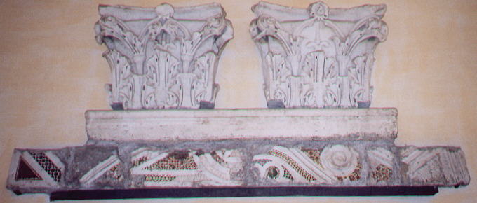 Roman capitals and mosaics walled in the porch of the cathedral